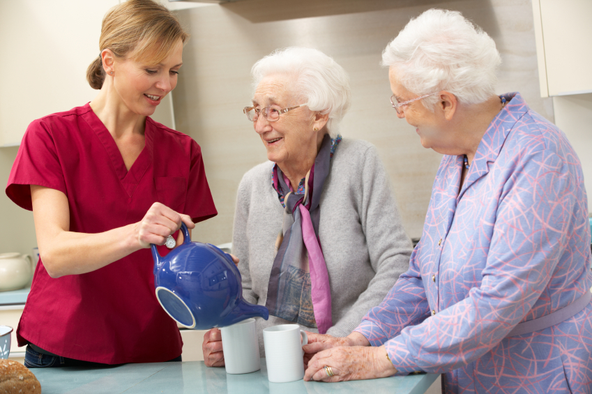 Senior women at home with carer